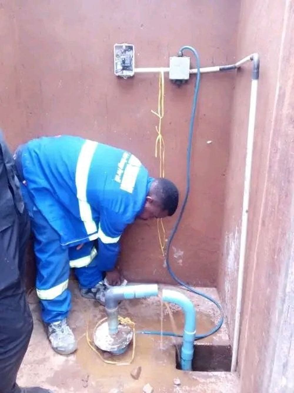 Renewable energy engineer servicing and testing solar PV installation
